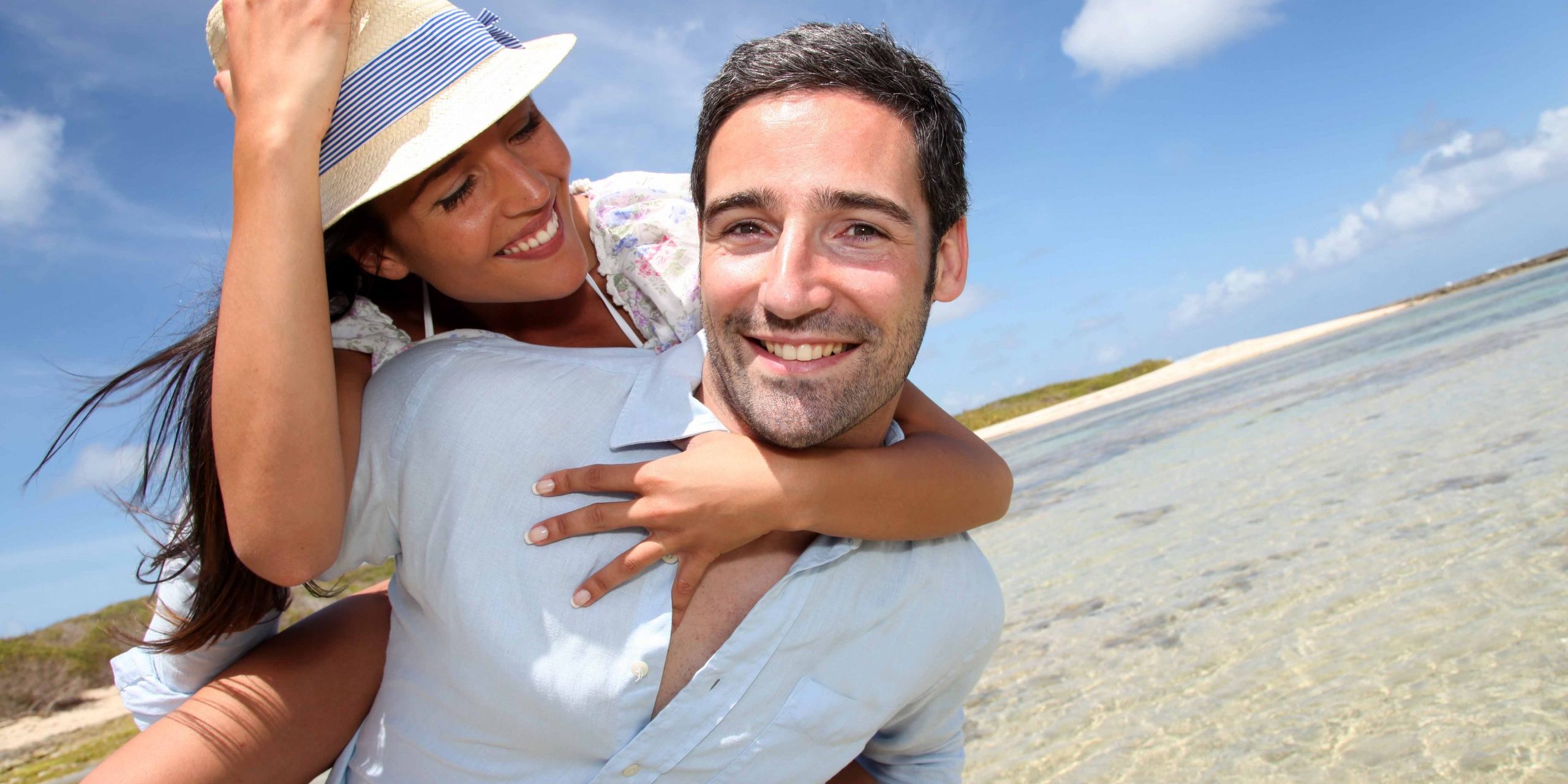 Lovers enjoying sunny day at the beach.